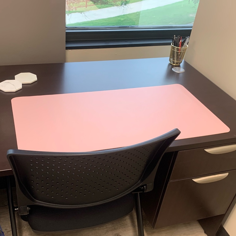 Pink leather desk mat.